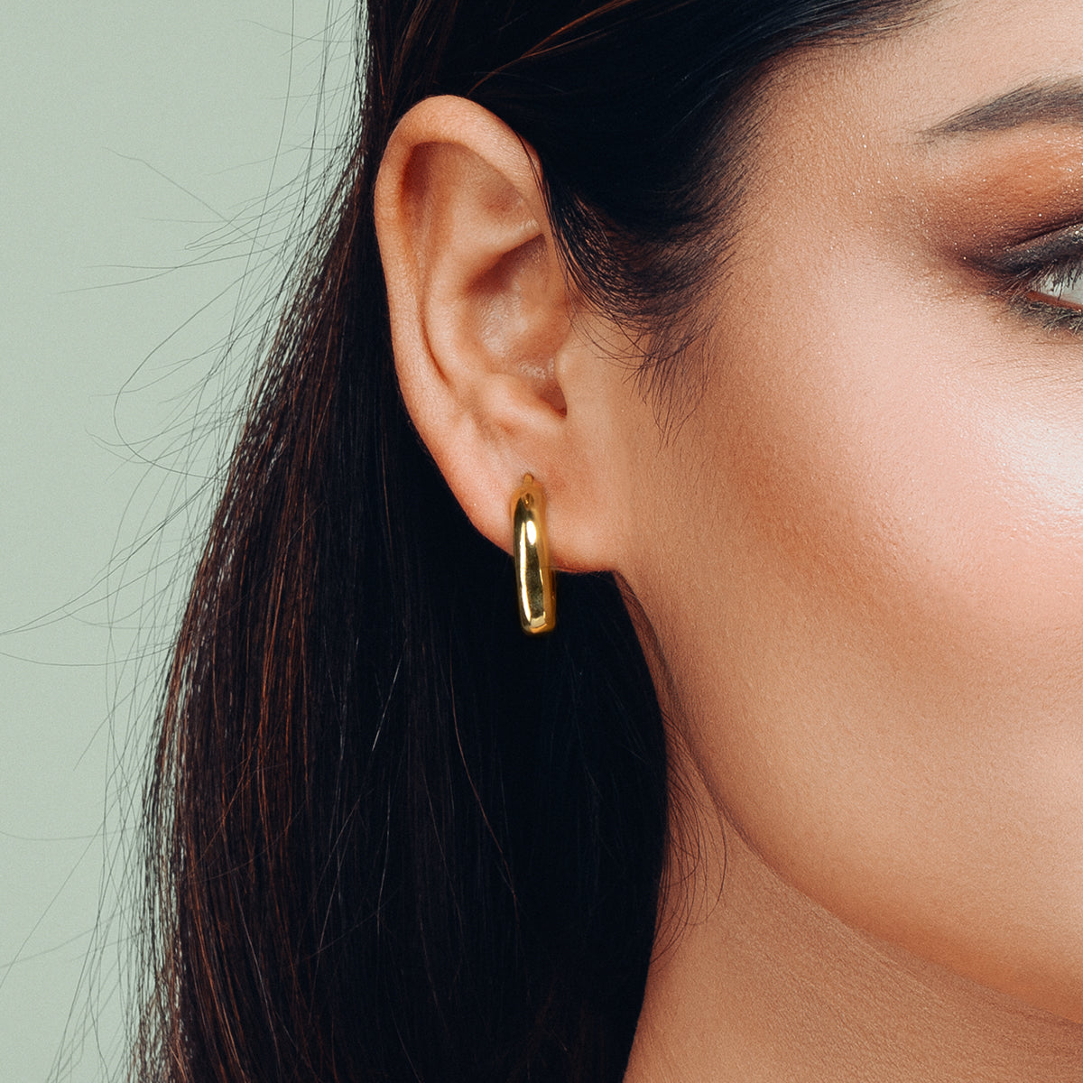 Side profile showcasing Gulban’s Dazzle Hoop Golden Earring, a contemporary 18k gold plated demi fine jewellery piece offering timeless elegance and versatile styling.