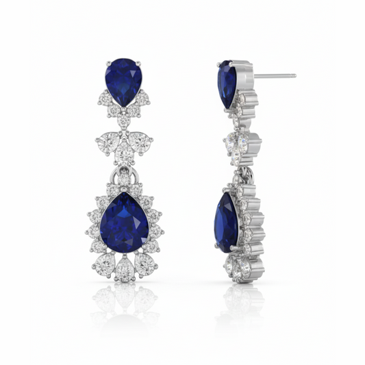 Pair of earrings with blue gemstones and diamond accents on Gulban Demi Fine Jewellery